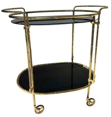 BRASS SERVING TROLLEY(CLICK PHOTO)
                                   PRODUCT DETAIL
ITEM NO:        SE-2787
DESCRIPTION: BRASS SERVING OVAL TROLLEY
WITH BLACK GLASS
SIZE (IN MM) : L- 718.82 X W- 449.58 X H 718.82
HEIGHT TOP SHELF: 685.8
MATERIAL:  BRASS / FINISH:  BRASS ANTIQUE
MINIMUM ORDER QTY:  5 TO 15 PIECES
DELIVERY TERMS: F.O.B. & C.I.F. ( BY AIR AND SEA)
PRICE OPTIONS AVAILABLE ARE IN:  US DOLLARS & EURO & GB.POUND
ASK US FOR PRICES
